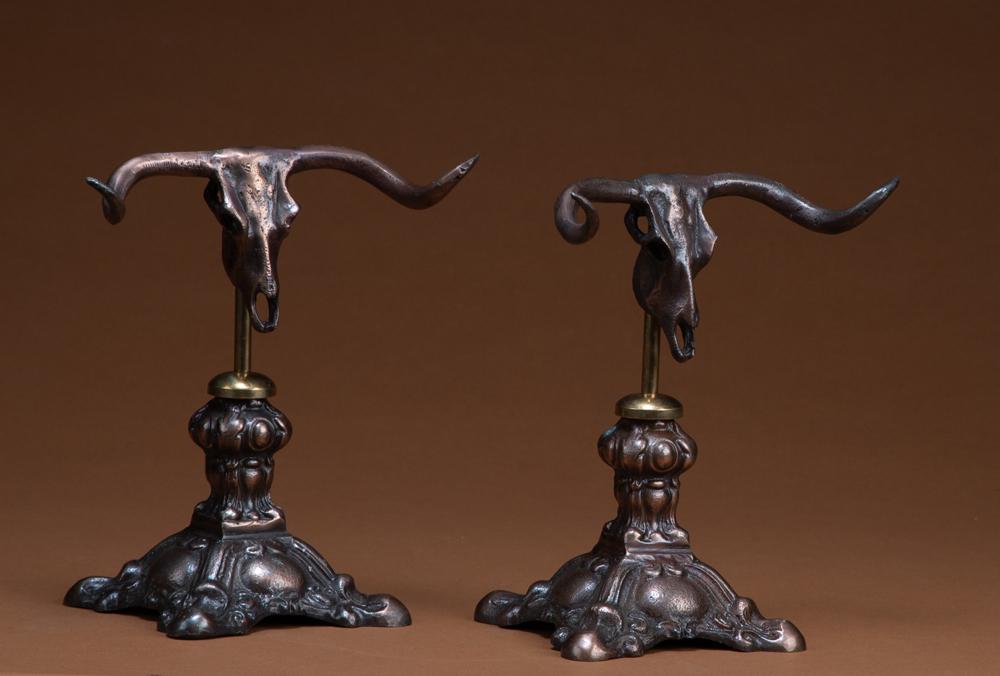 Two Steer head Pistol Stands with 3 3/4" fancy footed: Two Steer head Pistol Stands with 3 3/4" fancy footed bases. These stands will work with most all revolvers and some automatics. WILL BE SOLD 2 X THE BID. KING COLLECTION
