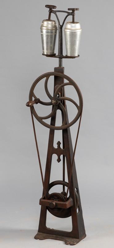 An early cast iron leather belt driven, double Shaker,: An early cast iron leather belt driven, double Shaker, circa late 1800s to turn of the century. Complete with what appears to be the original mixing cups. Shaker showing signs of the original paint, 4