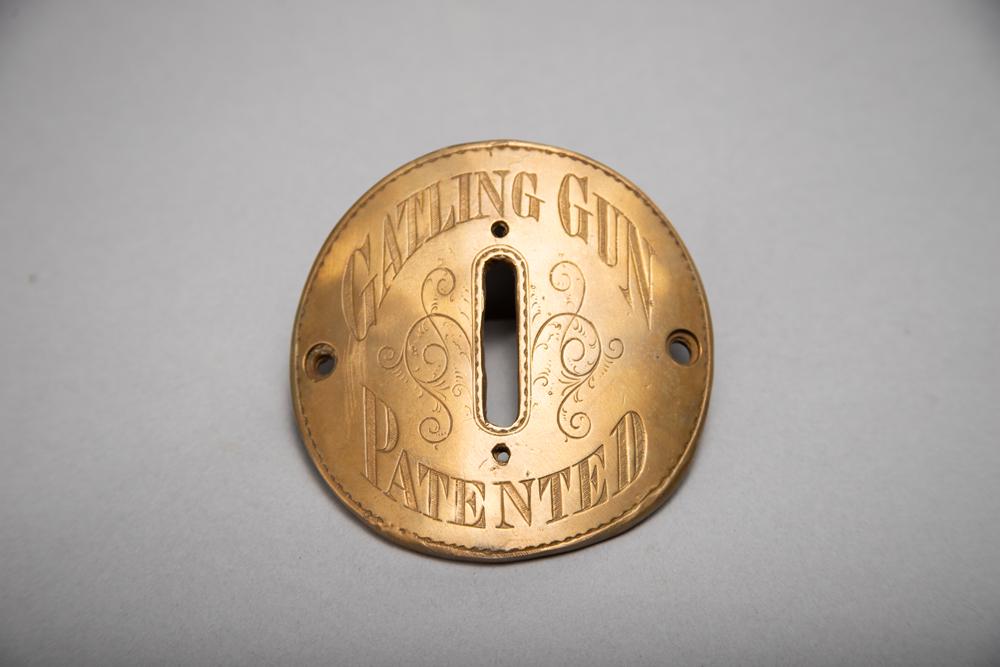 Excellent Colt Gatling Gun Plaque from an 1883 Colt: Excellent Colt Gatling Gun Plaque from an 1883 Colt Gatling Gun. This typical bronze plaque would be affixed to the breech of a barrel housing and would also house the spirit level. The spirit level w