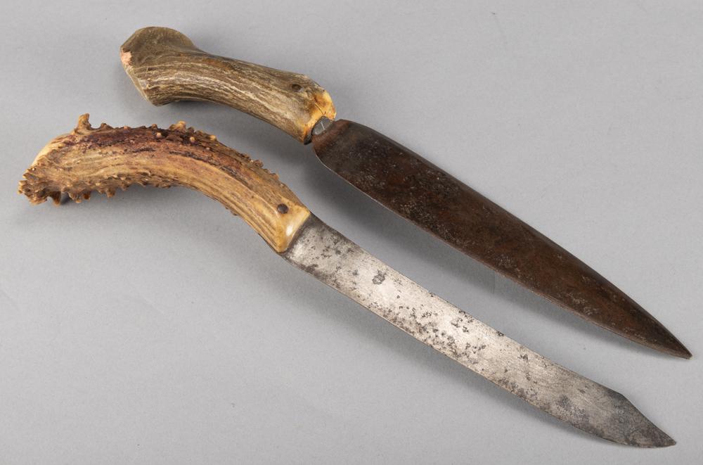 This consists of two handmade Side Knives, both with: This consists of two handmade Side Knives, both with buck horn handles. Spear point Knife has 8 3/4" blade, 13 3/4" overall length. The other has 8 1/4" blade with 13 3/4" overall length. WILL BE SOLD
