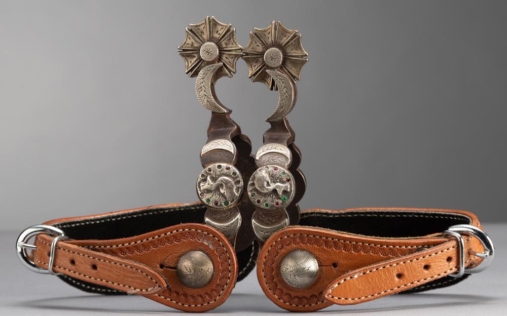 Pair of double mounted Spurs by the late Texas Bit and: Pair of double mounted Spurs by the late Texas Bit and Spur Maker Walt Rambo, done in the famous McChesney peacock & crescent pattern, 1 5/8" windmill style engraved rowels, etched, fixed buttons. Spu