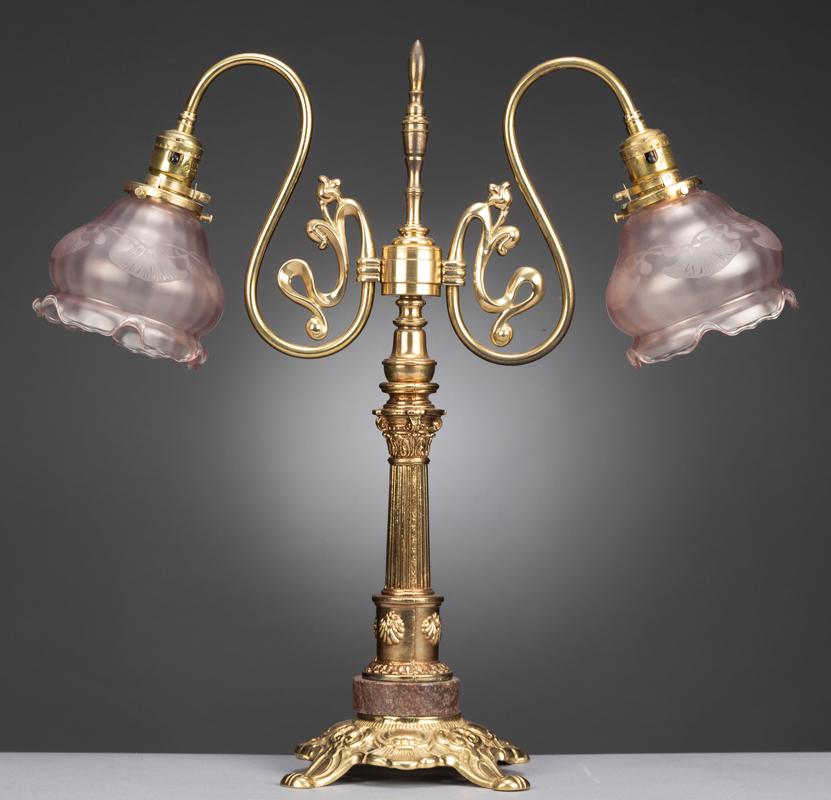 Brass Table Lamp on fancy 7" footed, marble base with: Brass Table Lamp on fancy 7" footed, marble base with double drop pink etched, fluted edge shades. Lamp measures 20 3/4" tall. From the James Estate, Brenham, Texas.