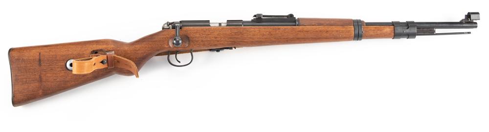 Chinese, Model TU-33/40, bolt action Carbine, .22 LR: Chinese, Model TU-33/40, bolt action Carbine, .22 LR caliber, SN 9201022, 20" barrel, retains majority of original blue finish, wooden stock, complete with cleaning rod and leather carry strap. (MODER