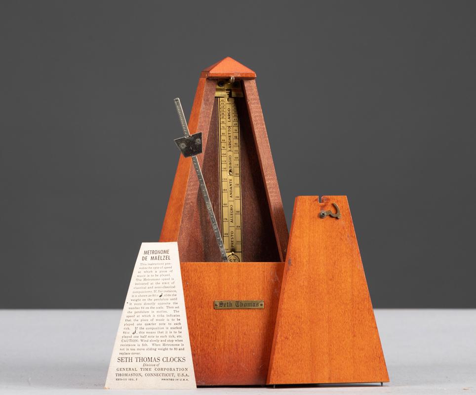 Wooden Metronome made by Seth Thomas, excellent working: Wooden Metronome made by Seth Thomas, excellent working order, spring wound, 9" T x 4 1/4" Square base.