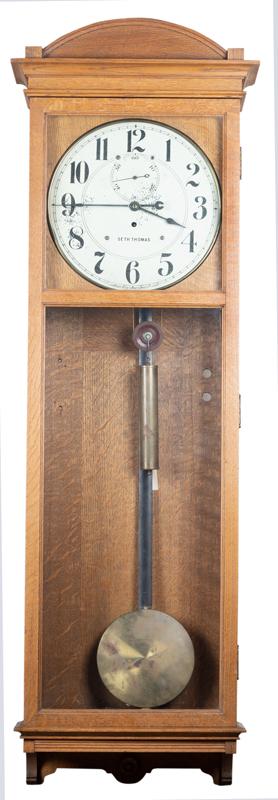 Very desirable antique Seth Thomas oak case, weight: Very desirable antique Seth Thomas oak case, weight driven, wall Regulator Clock, circa 1900-1910. Clock measures 58" long with 3 1/2" crest x 17" wide x 7 1/2" deep, with sweep second hand, complete