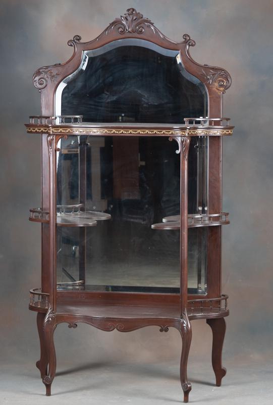 Antique beveled glass mahogany Wall Curio, circa: Antique beveled glass mahogany Wall Curio, circa 1915-1920, with carved crest and full length beveled mirror, 61 1/2" tall x 34" wide x 12" deep, cabriole legs and fancy spindle curio shelves. Excelle