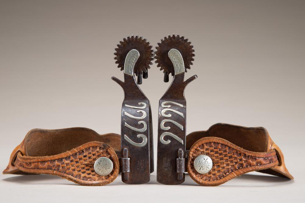 Pair of double mounted Spurs by the late Texas Bit and: Pair of double mounted Spurs by the late Texas Bit and Spur Maker Jerry Cates, #2124, with silver overlay "6666", on one side and raised engraved silver steer head on opposite heel bands. Very desirab