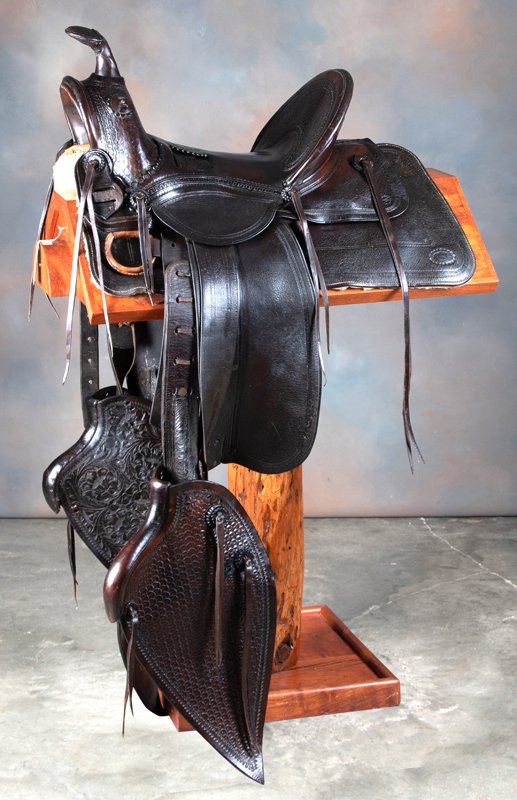 Early loop seat Saddle marked "P.A. Wilkerson,: Early loop seat Saddle marked "P.A. Wilkerson, 1871-1941", with nice tooling. Wilkerson opened his shop 1890-1920 in Gillette & Buffalo, Wyoming. He went to work for N. Porter around 1930 and is rumor