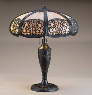 Antique bent panel, slag glass Table Lamp, circa: Antique bent panel, slag glass Table Lamp, circa 1920-1925, attributed to Pittsburg Lamp Co., multi-panel shade measures 16" diameter x 23" tall. Excellent original patina. THE LATE BERTA HACKNEY