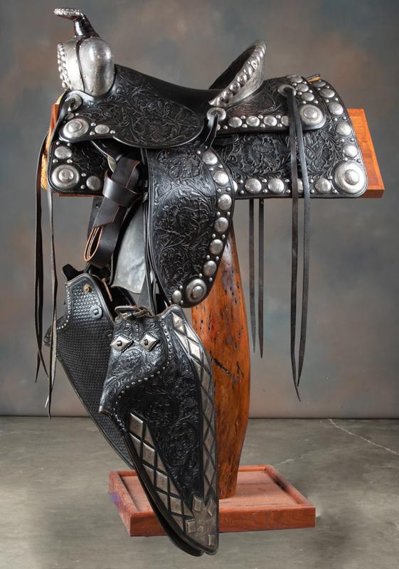 Beautiful vintage, engraved sterling mounted and highly: Beautiful vintage, engraved sterling mounted and highly floral tooled Parade Saddle, maker marked "N. Chas. Castillo, Saddle Maker, Los Angeles, Calif." Saddle has 14" seat with 4" engraved silver can