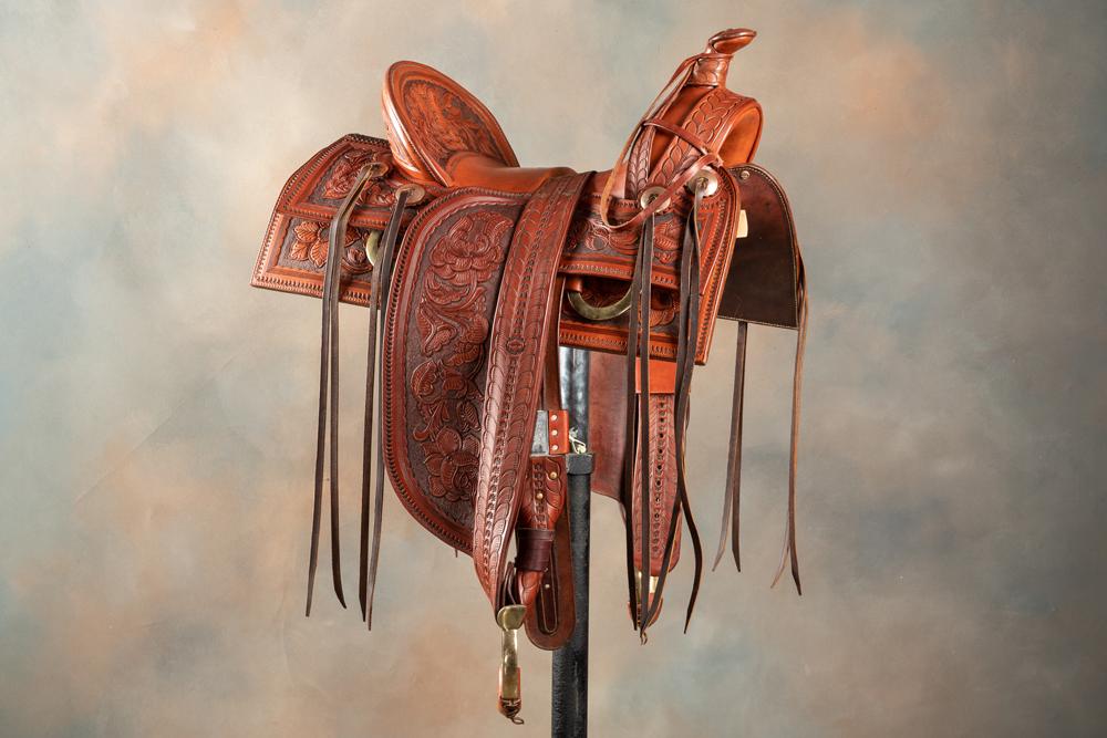 Beautiful custom made tooled Saddle by noted: Beautiful custom made tooled Saddle by noted Saddlemaker & Leathersmith Casey Jordan, Phoenix, AZ. Saddle has high A-fork with Samstag rigging, 4" cantle, square skirt, very desirable 15" loop seat, e
