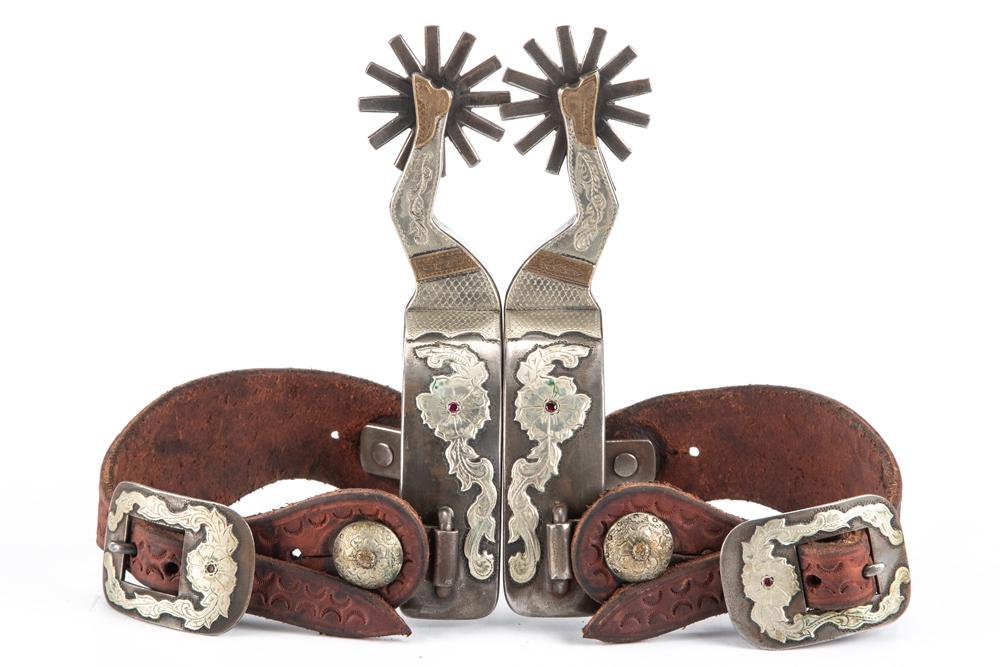 Pair of R.F. Ford double mounted Spurs, #2265, in the: Pair of R.F. Ford double mounted Spurs, #2265, in the very desirable gal-leg pattern, all hand engraved silver overlay with floral mountings on heel bands with jewels. Mounted with "Liz Ford" marked t