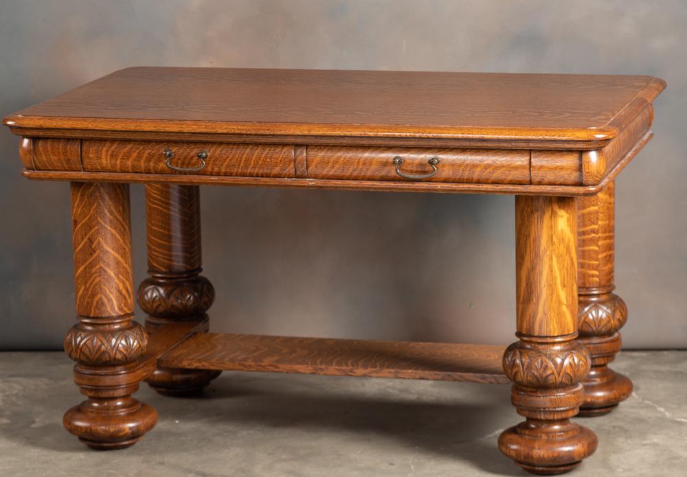 Extremely fine quarter sawn oak Library Table, circa: Extremely fine quarter sawn oak Library Table, circa 1900-1910, with drawered skirt and massive carved legs supporting top, full stretcher base, in excellent finish and condition. HACKNEY ESTATE 31.5 