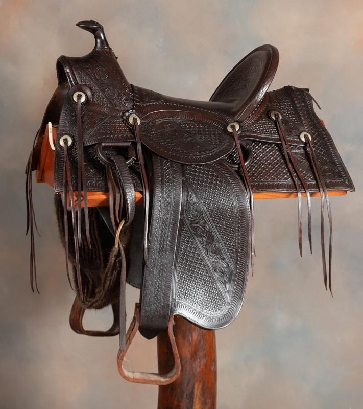 Nice early high back, floral tooled Saddle marked "W.J.: Nice early high back, floral tooled Saddle marked "W.J. Murphy / Ft. Smith, ARK.", very desirable A-fork with 16" seat and square skirt, 5" cantle. Leather is supple, saddle is in good condition. This