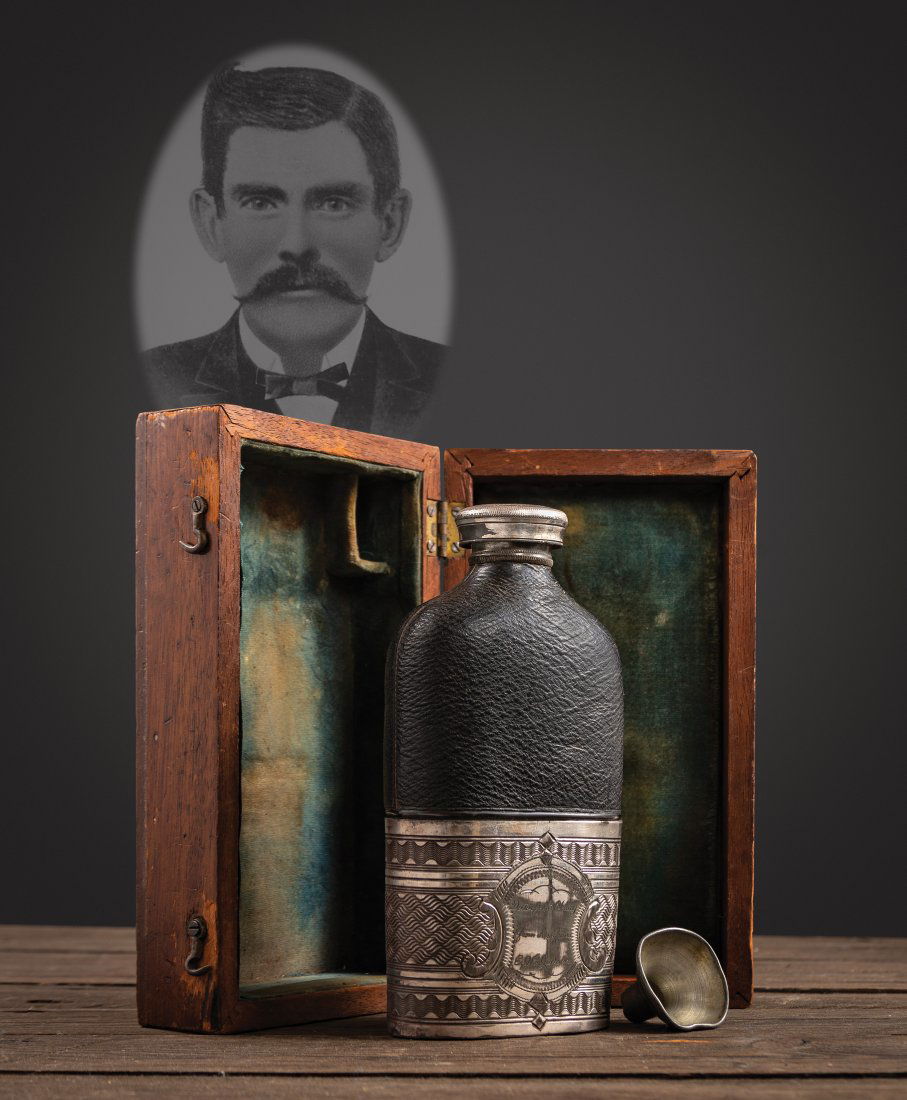 ATTENTION COLLECTORS OF THE OLD WEST. THE ICONIC AND: ATTENTION COLLECTORS OF THE OLD WEST. THE ICONIC AND ONE OF A KIND "DOC HOLLIDAY" PRESENTATION WHISKEY FLASK. John Henry (DOC) Holliday (1851-1887), was presented this flask by E.Z.C. Judson (Ned Bunt