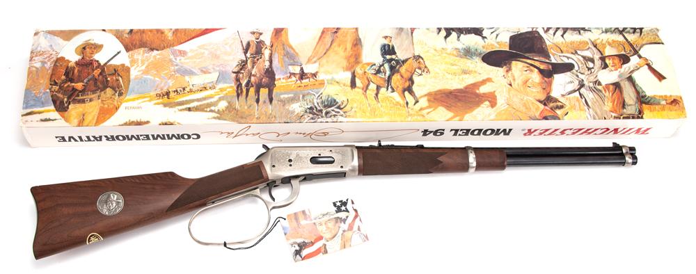 New in box Winchester, Model 94, Lever Action Saddle: New in box Winchester, Model 94, Lever Action Saddle Ring Carbine, John Wayne Commemorative, .32/40 caliber, SN JW43595, blue 18" round barrel with stainless engraved receiver and large loop, unfired 