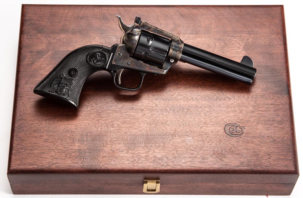 New in case Colt, The Duke, New Frontier, Single Action: New in case Colt, The Duke, New Frontier, Single Action Revolver, John Wayne Commemorative, .22 caliber, SN G211332, blue finish barrel with silver overlay "John Wayne / The Duke", 4 1/4" barrel, case