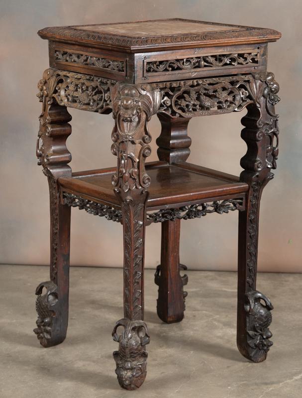 Early heavily carved Teak wood Lamp Table with carved: Early heavily carved Teak wood Lamp Table with carved suspended stretcher, floral and bird carving, and inset marble top, 31 1/2" tall x 16" square top. HACKNEY ESTATE