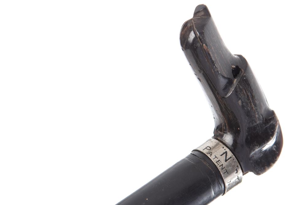 Antique Cane Gun with wooden dog head handle and silver: Antique Cane Gun with wooden dog head handle and silver spacer marked "N" TYPE / PATENT NO. 55038", with concealed loading area half way down the shaft, shows to be approximately .32 caliber. Has an a