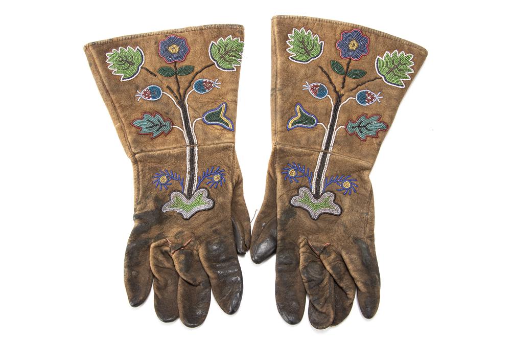 Fine pair of vintage Wild West beaded Gauntlets with: Fine pair of vintage Wild West beaded Gauntlets with beaded cuffs showing some bead loss, fragile leather palms, 13" long, sold in framed display for protection.