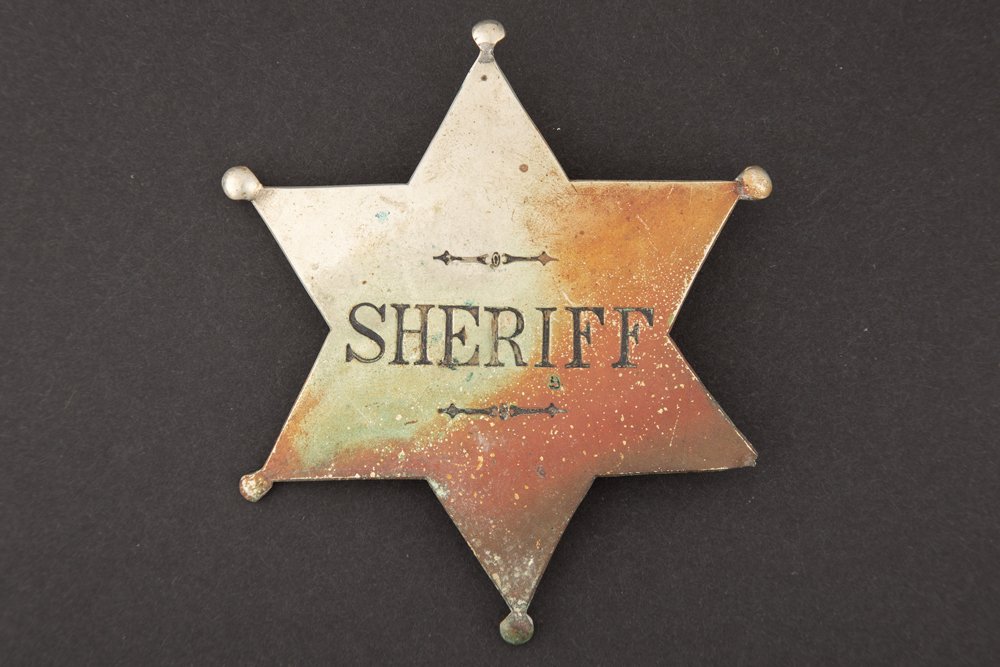 Sheriff Badge, 6 point ball star, 4 7/8" across points.: Sheriff Badge, 6 point ball star, 4 7/8" across points. NOTE: One ball missing at point. GEORGE JACKSON ESTATE