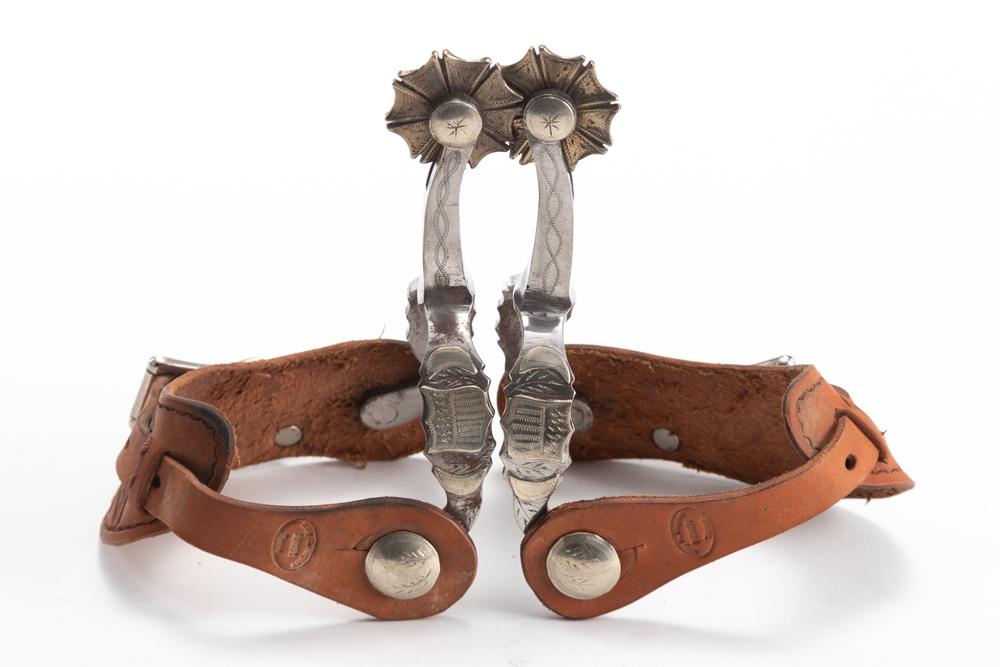 Pair of double mounted Spurs by Austin, Texas Bit and: Pair of double mounted Spurs by Austin, Texas Bit and Spur Maker, the late Walt Rambo, double mounted with hand engraved silver overlay shields on heel bands and etched shanks, windmill style rowels. 