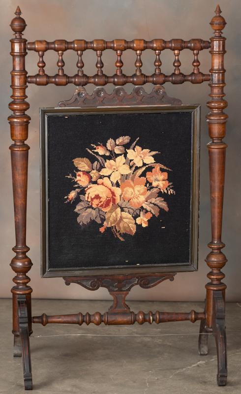 Victorian Fire Screen, circa 1880s, with fancy: Victorian Fire Screen, circa 1880s, with fancy spindles, framed needlepoint in center that measures 21 1/2" x 22". Actual stand measures 50" tall x 30" wide x 18" at base, in original estate finish an