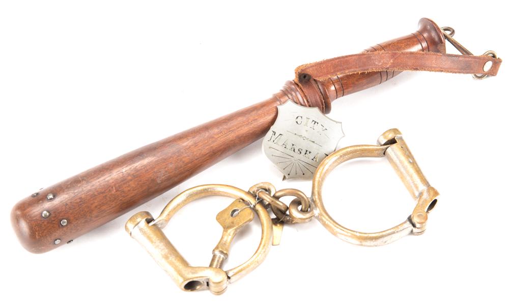 This lot consists of three items that were once: This lot consists of three items that were once property of City Marshal Walter Snay to include: (1) Shield Badge marked "City Marshal" with his name scratched on back and dated 1903. A gum label on b
