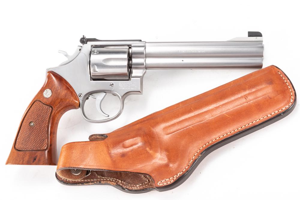 Smith & Wesson, Model 686, Double Action Revolver, .357: Smith & Wesson, Model 686, Double Action Revolver, .357 MAG caliber, SN AA12941, stainless finish, 6" barrel, S&W checkered grips, very good condition with light turn line, adjustable rear sight. Sold