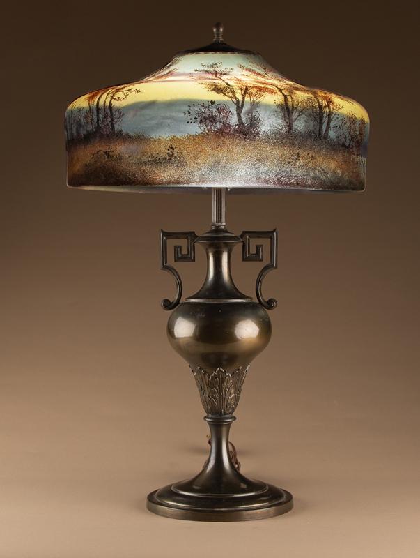 Beautiful reverse painted antique Table Lamp, circa 1915-1920, shade is signed "Handel 6193", base: Beautiful reverse painted antique Table Lamp, circa 1915-1920, shade is signed "Handel 6193", base has original bronze patina, 16" scenic fall shade. Lamp measures 25" tall. Very desirable. KING COLLE
