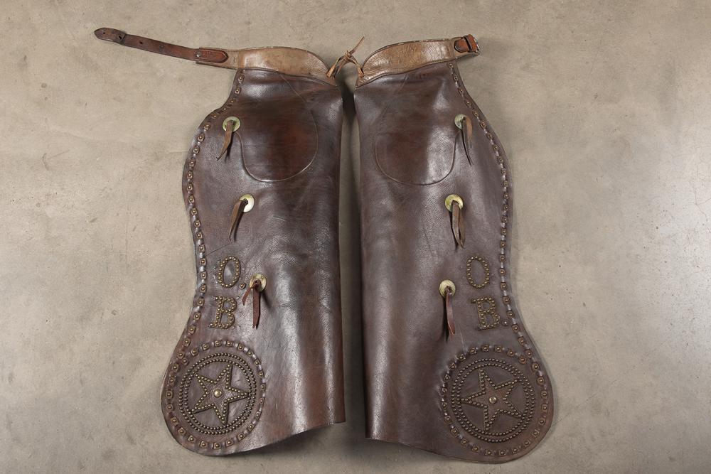 Pair of "H.H. Heiser" marked, two tone spotted batwing Chaps with very unique spotted and leather: Pair of "H.H. Heiser" marked, two tone spotted batwing Chaps with very unique spotted and leather laced border, inside pockets, very good condition, leather is supple with very desirable five point sp