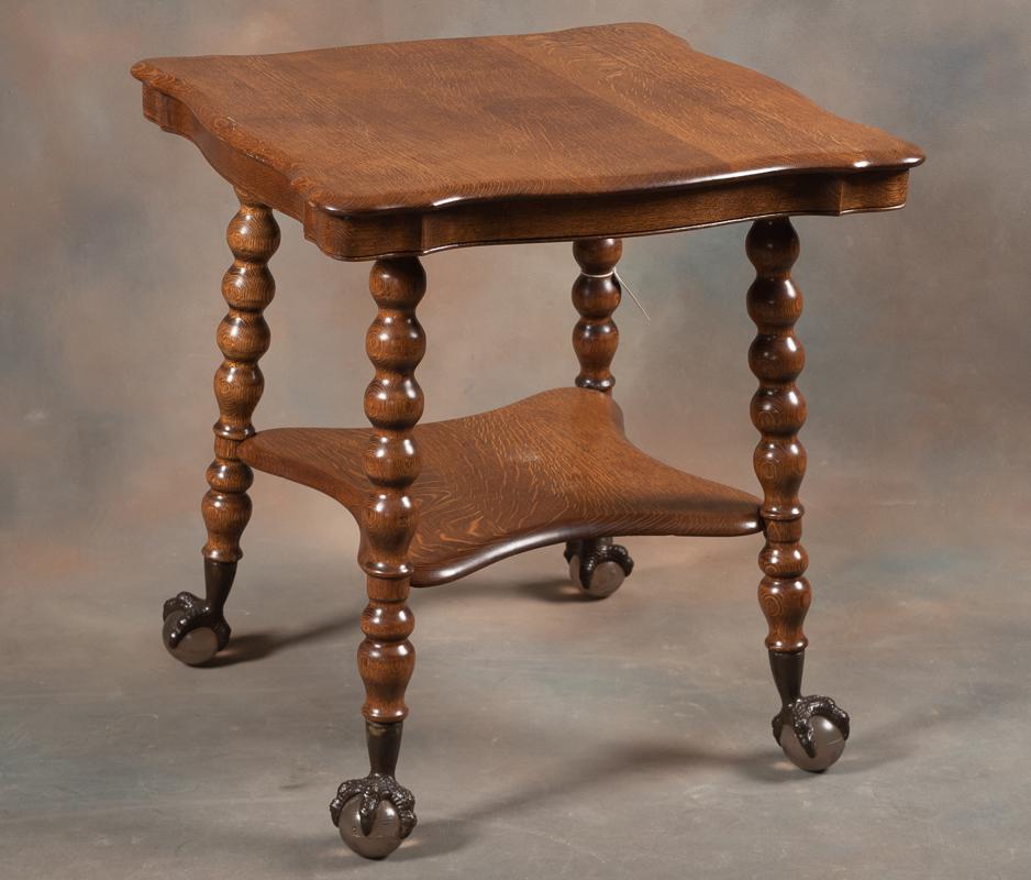 Beautiful antique quarter sawn oak Lamp Table, circa 1900-1910. Excellent finish and condition, with: Beautiful antique quarter sawn oak Lamp Table, circa 1900-1910. Excellent finish and condition, with very desirable Tiffany style glass ball and claw feet. Table has a 27" square scalloped top, with f