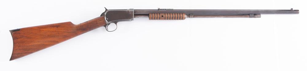 Winchester, Model 1890, slide action Rifle, .22 WRF caliber, SN 558908, manufactured 1916, 24": Winchester, Model 1890, slide action Rifle, .22 WRF caliber, SN 558908, manufactured 1916, 24" octagon barrel, showing some remaining finish with balance being dark grey patina. Smooth action, walnut 
