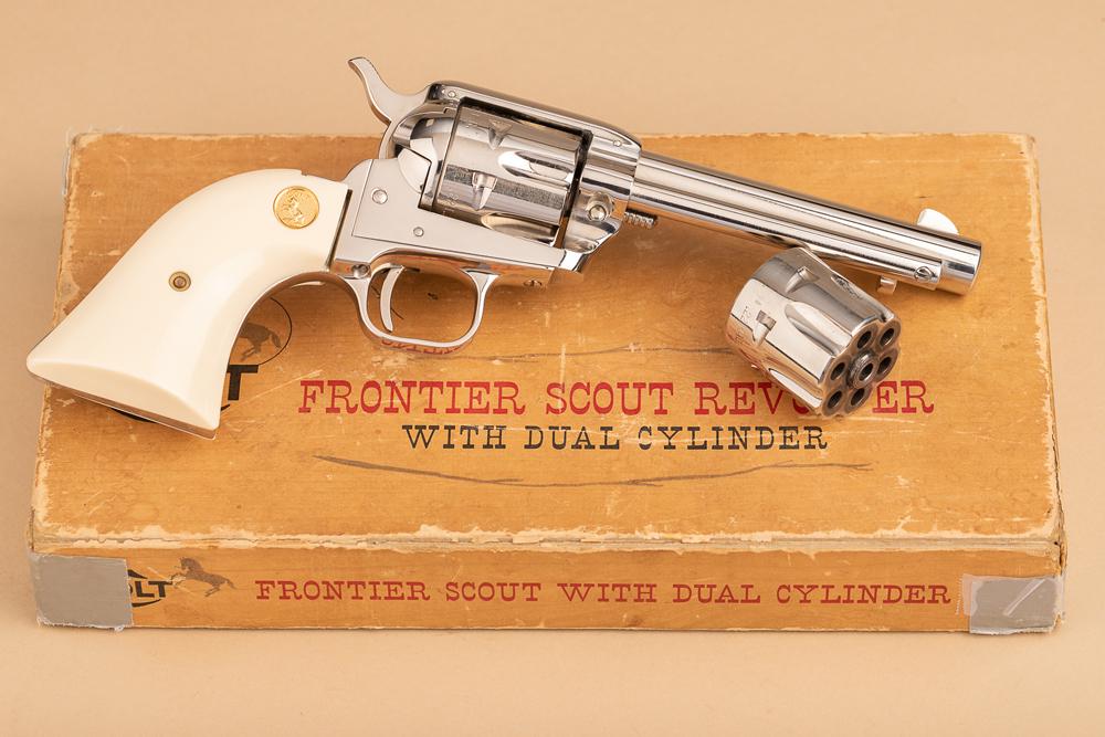 Factory boxed Colt, Frontier Scout, SA Revolver, .22 caliber with extra .22 MAG cylinder, SN 29298K.: Factory boxed Colt, Frontier Scout, SA Revolver, .22 caliber with extra .22 MAG cylinder, SN 29298K. 4 3/4" barrel, factory nickel finish, white plastic grips. Sold in original box. NOTE: Box is fragi