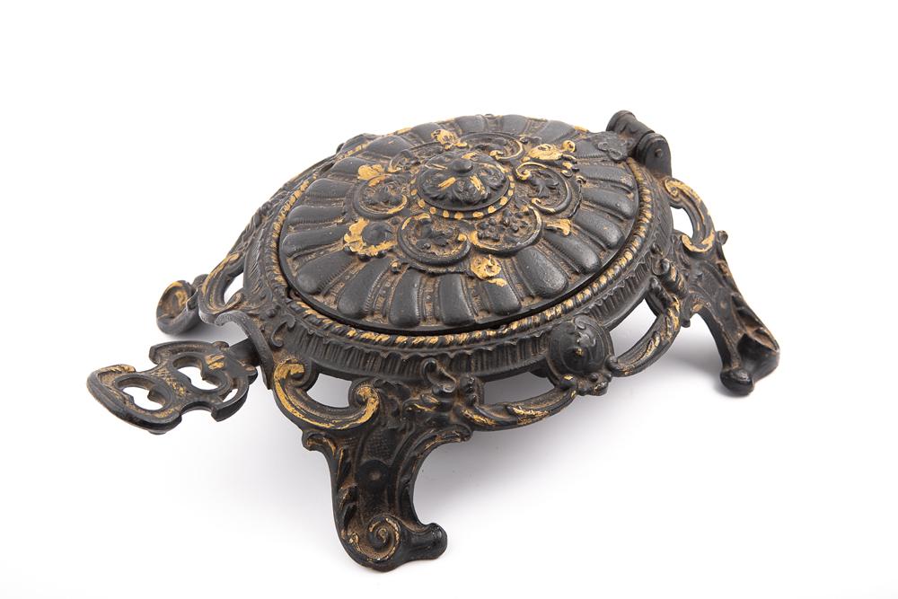 ATTENTION COLLECTORS OF RARE SPITTOONS: An antique, heavily embossed cast iron, footed, mechanical: ATTENTION COLLECTORS OF RARE SPITTOONS: An antique, heavily embossed cast iron, footed, mechanical Spittoon in turtle shape, circa 1880s -1900, with original removable cast iron spit tray, 14" L x 10"