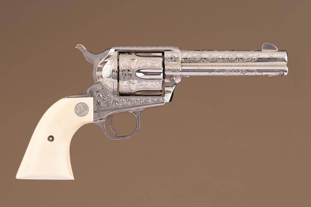 Incredible boxed pair of fully engraved Colt, SAA Revolvers, .357 MAG. caliber, SN 53468SA and SN: Incredible boxed pair of fully engraved Colt, SAA Revolvers, .357 MAG. caliber, SN 53468SA and SN 61471SA, 4 3/4" barrels, nickel finish, ivory grips with Colt Medallions. Excellent condition. This ma