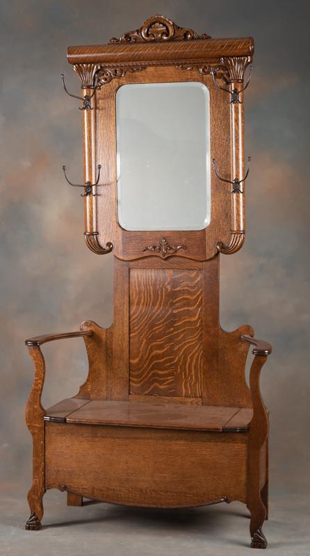 Antique quarter sawn oak, lift seat Hall Tree, circa 1900-1910. Hall tree measures, 80" tall x 38": Antique quarter sawn oak, lift seat Hall Tree, circa 1900-1910. Hall tree measures, 80" tall x 38" wide x 16" deep. Has beveled mirror and four cast iron coat and hat hooks. Excellent finish and condi