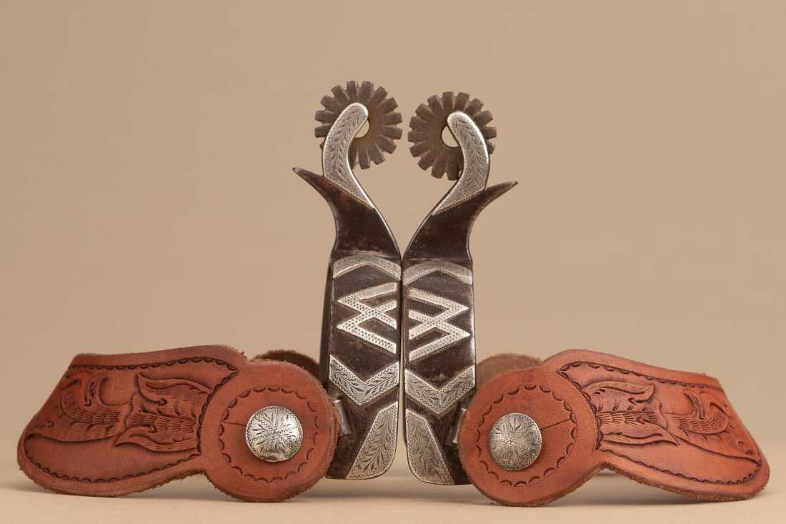 Pair of double mounted Spurs by noted Michigan Bit and Spur Maker Randy Butters, #533, with hand: Pair of double mounted Spurs by noted Michigan Bit and Spur Maker Randy Butters, #533, with hand engraved silver Tepees on one side and the name "JAY" hand engraved in silver overlay on opposite heel 
