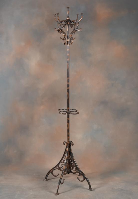 Antique cast iron revolving Hat and Coat Rack in original copper flashed finish, 72" tall x 16": Antique cast iron revolving Hat and Coat Rack in original copper flashed finish, 72" tall x 16" footed base. KING COLLECTION