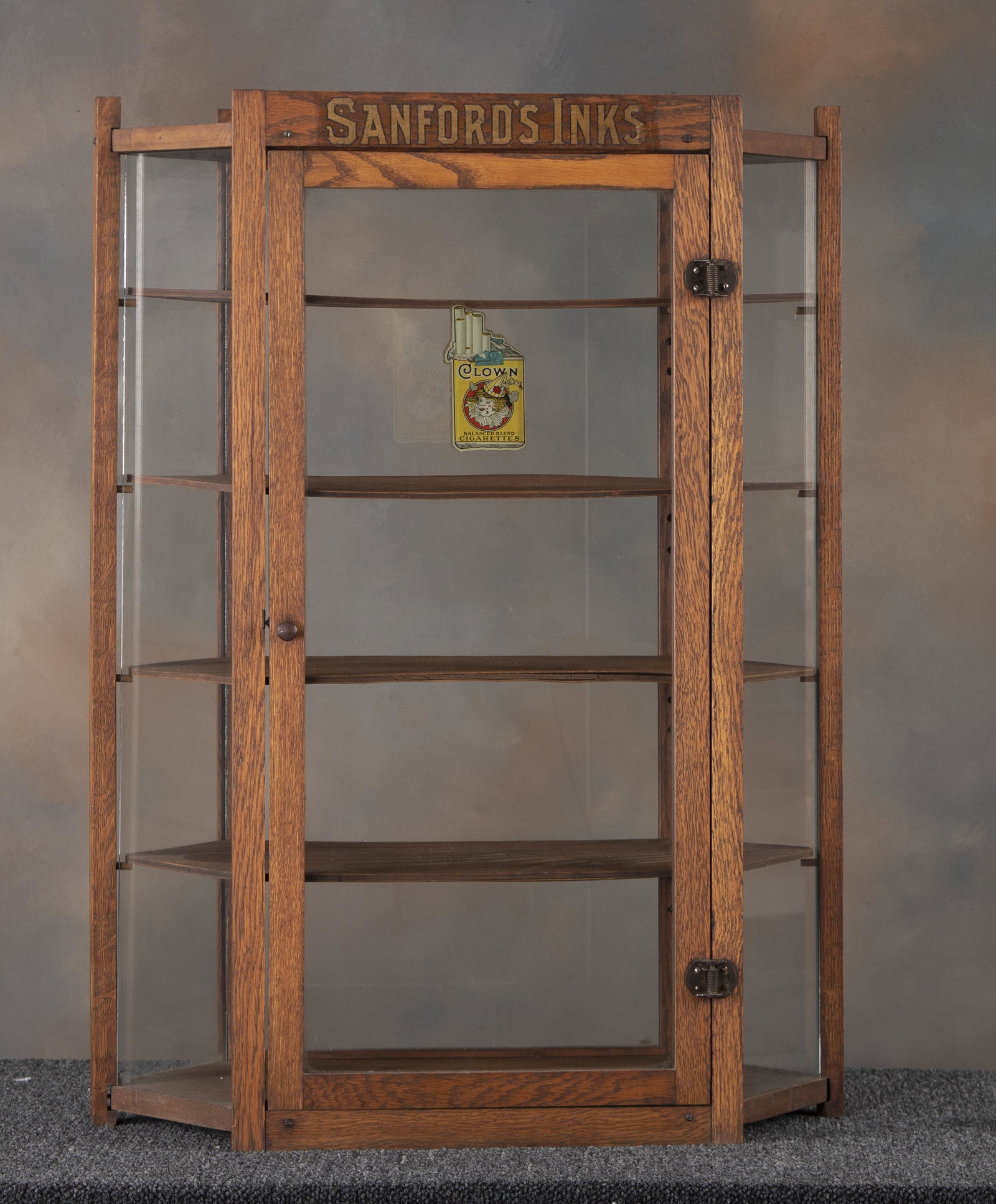 Antique oak, counter top model Showcase, circa 1900-1920, advertising "Sanford Inks", 32 3/4" tall x: Antique oak, counter top model Showcase, circa 1900-1920, advertising "Sanford Inks", 32 3/4" tall x 24" wide x 11" deep, with adjustable shelves, in original finish. KING COLLECTION