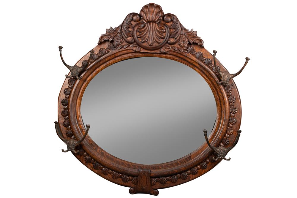 Beautiful antique oval, oak Hanging Mirror, circa 1900-1910, original paper label marked: Beautiful antique oval, oak Hanging Mirror, circa 1900-1910, original paper label marked "Manufactured Jack & Hartley Furniture Co, Lewiston, ME." Mirror is heavily carved, in original finish and cond