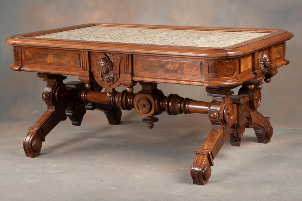 Fine Walnut Victorian marble top Coffee Table, attributed to Jolliffe with the Jolliffe ladies face: Fine Walnut Victorian marble top Coffee Table, attributed to Jolliffe with the Jolliffe ladies face positioned on all four sides of the skirt. Ornately carved legs and stretcher. Excellent finish and