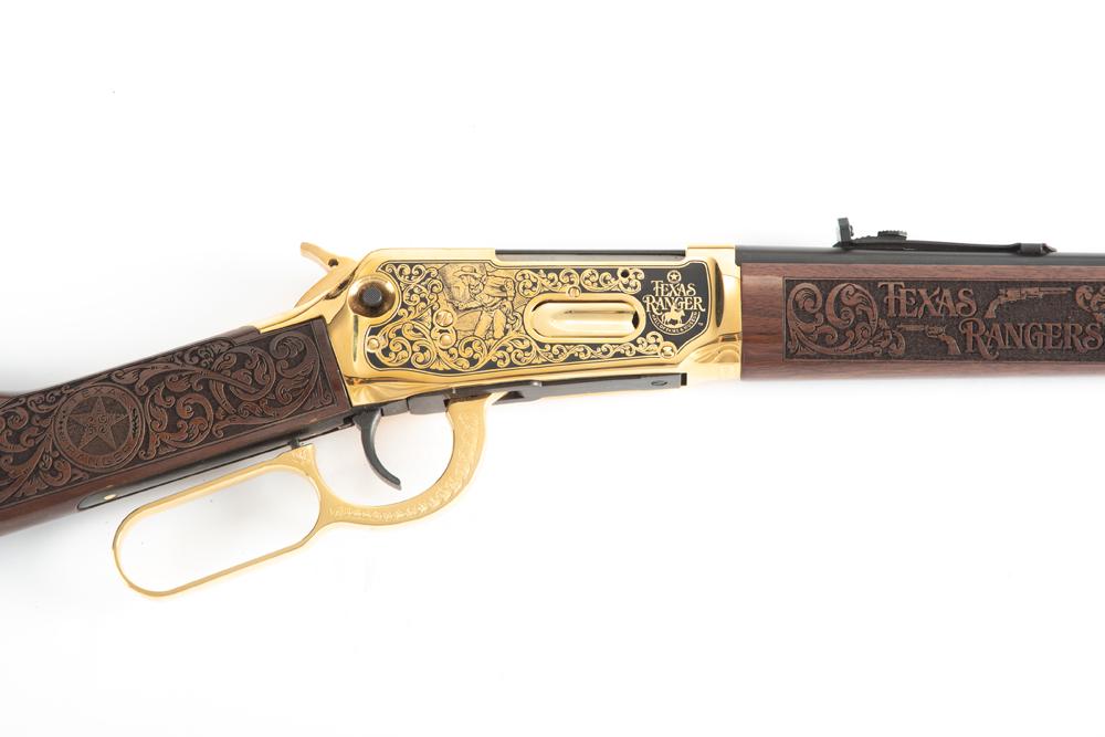 New In Box Winchester Model 94AE, Lever Action Carbine,.30/30 WIN caliber, SN 6278040, blue finish: New In Box Winchester Model 94AE, Lever Action Carbine,.30/30 WIN caliber, SN 6278040, blue finish with gold plated receiver, lever and barrel band. Engraving was done by A & A Engraving, carved stock