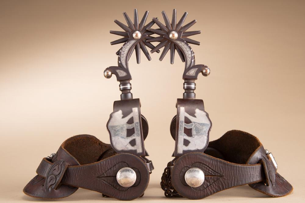 Incredible pair of Tony Wallace double mounted Spurs, #29, hand engraved silver in the Elko Star: Incredible pair of Tony Wallace double mounted Spurs, #29, hand engraved silver in the Elko Star pattern with engraved silver overlaid bear on opposite heel bands. Fantastic pair mounted with "Bill He
