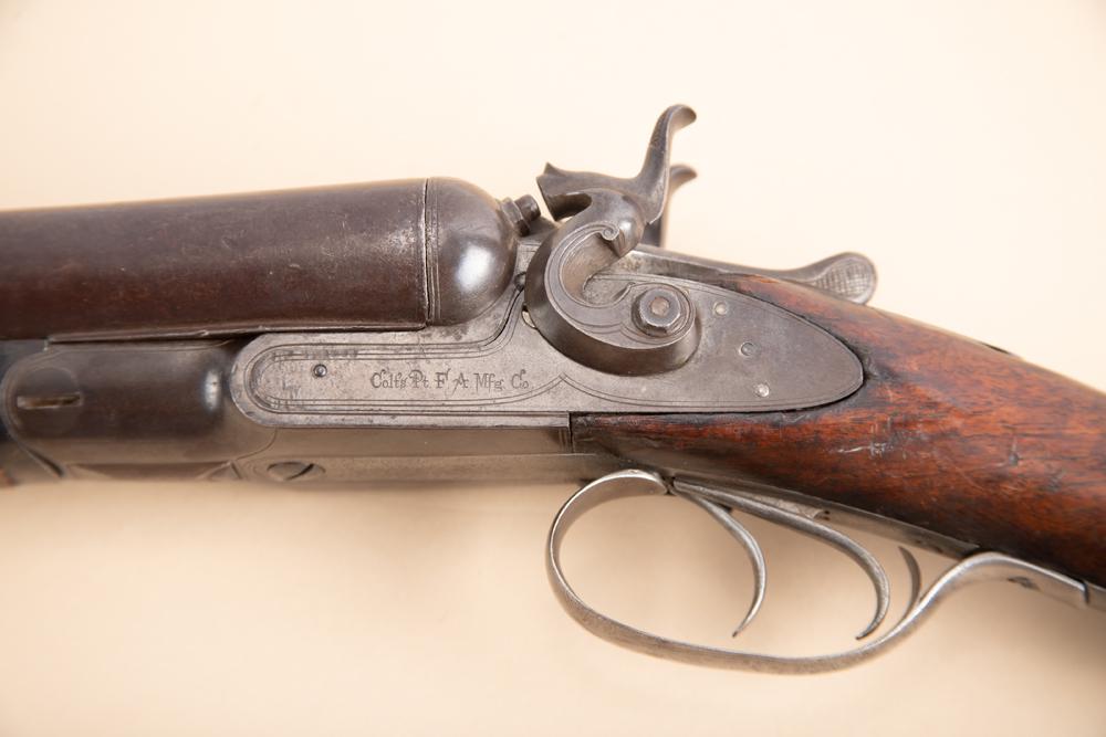 Antique Colt Coach Gun, 18" double barrels with mule ear hammers, SN 20623, 10 gauge, both receiver: Antique Colt Coach Gun, 18" double barrels with mule ear hammers, SN 20623, 10 gauge, both receiver and barrels have matching numbers, bores have normal black powder pitting from use.