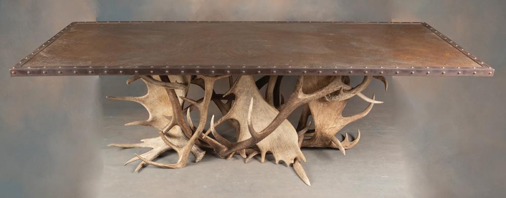 Incredible large custom made Dave Karp Designs hand hammered copper top Table, base is decorated: Incredible large custom made Dave Karp Designs hand hammered copper top Table, base is decorated with several moose and elk horns. Would work well in any Cabin or Lodge whether it be in Texas or Color