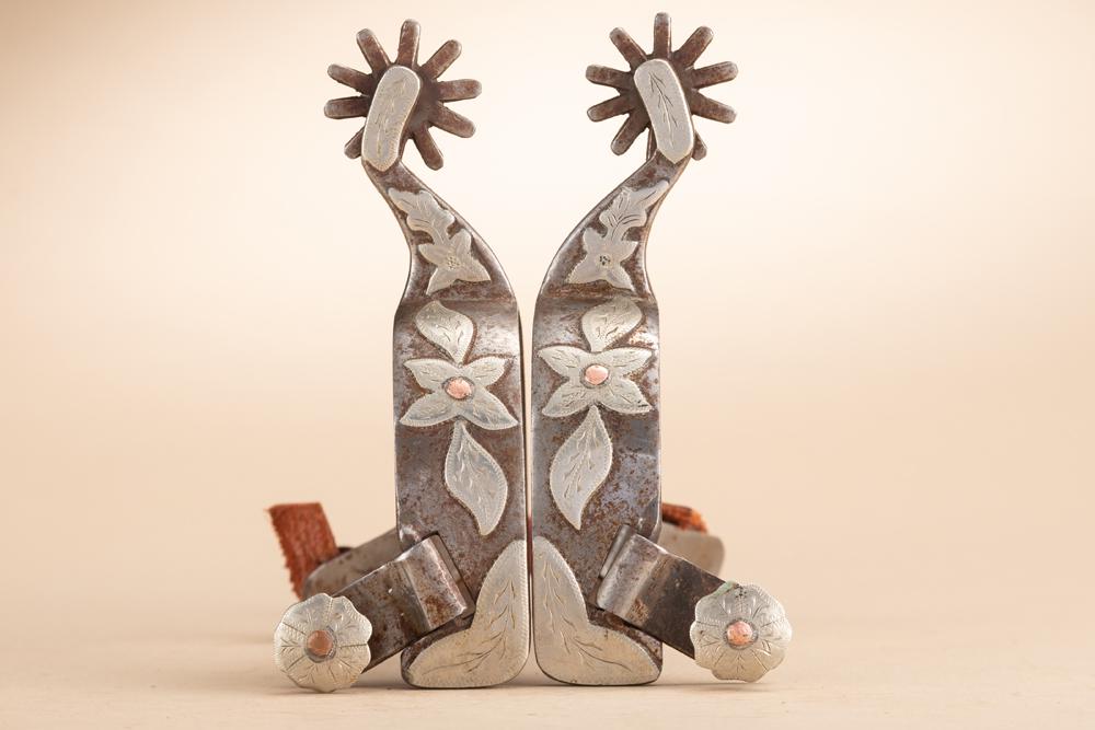 Pair of Danny Pollard Spurs, #299, single mounted with hand engraved silver overlay, floral etched: Pair of Danny Pollard Spurs, #299, single mounted with hand engraved silver overlay, floral etched swing buttons. The late Danny Pollard (1959-2021), Anson, Texas Bit and Spur Maker.