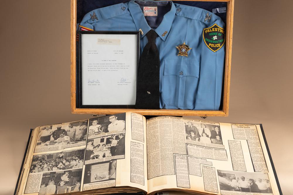 Wooden and glass showcase framed, documented Chief of Police Badge and Shirt once belonging to Chief: Wooden and glass showcase framed, documented Chief of Police Badge and Shirt once belonging to Chief of Police of Palestine, Texas, Jay Banks, Captain Texas Ranger, Retired. Document reads "I have thi