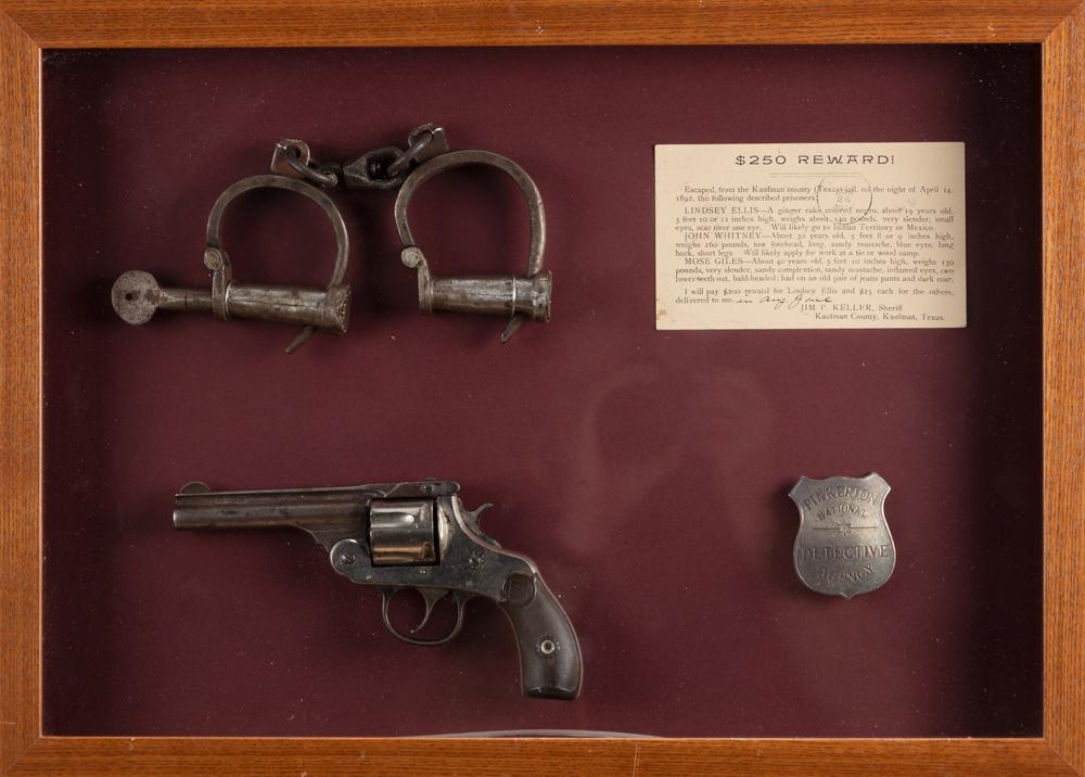 Framed collection of items to include: An H&R Tip Up Double Action Revolver, .38 SPL caliber, SN: Framed collection of items to include: An H&R Tip Up Double Action Revolver, .38 SPL caliber, SN 114420, retaining some original nickel finish, 3 1/2" barrel. A pair of early Wrist Cuffs, complete wit