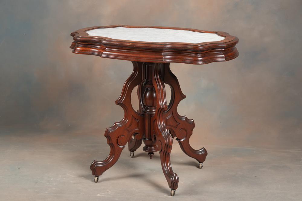 Very fine antique walnut Victorian turtle top, marble top Table with inset white marble top. Top of: Very fine antique walnut Victorian turtle top, marble top Table with inset white marble top. Top of table has burl trim, excellent finish and condition, circa 1870s, with original brass casters.